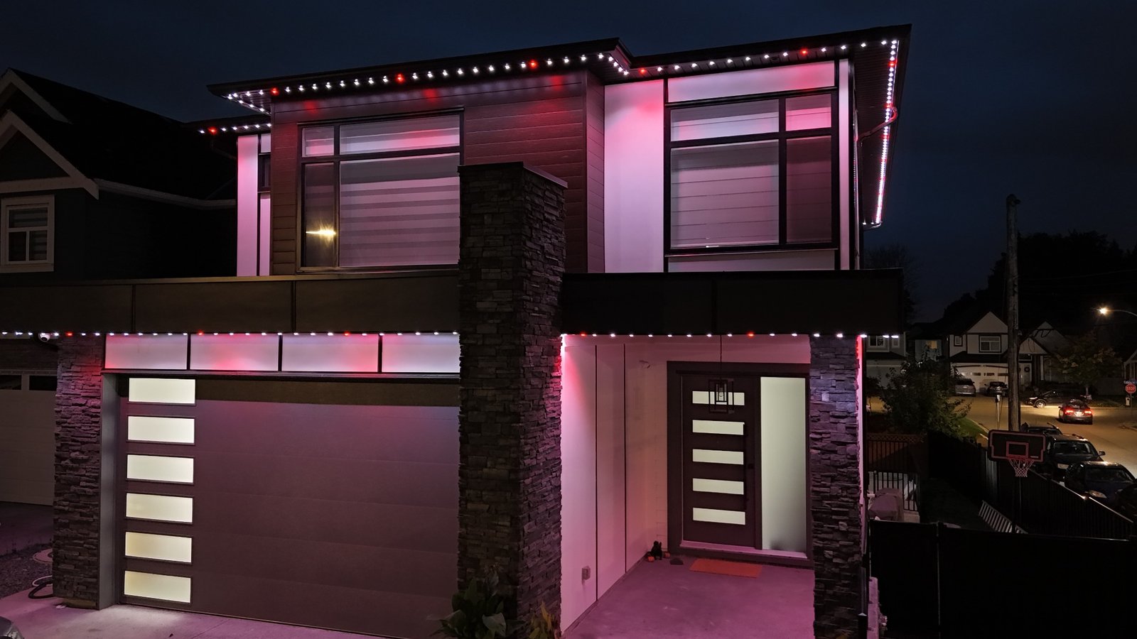 Modern Edmonton home with pink and white permanent lighting